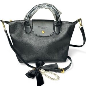 NWOT Zeta & Island Fashion Bag Black with bag charm.